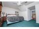 Bedroom features teal carpet and dark wood bedroom furniture at 9018 Lakeview Pkwy, Villa Rica, GA 30180