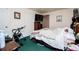 Bedroom features carpet and includes furnishings, such as a dresser and mounted television at 9018 Lakeview Pkwy, Villa Rica, GA 30180
