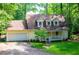 Inviting home with a front porch, attached garage, and beautiful landscaping at 9018 Lakeview Pkwy, Villa Rica, GA 30180