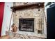 Cozy stone fireplace with wood mantel and classic design at 9018 Lakeview Pkwy, Villa Rica, GA 30180