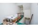 Hallway featuring a jetted tub next to a staircase with green carpet at 9018 Lakeview Pkwy, Villa Rica, GA 30180