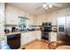 This kitchen features stainless steel appliances, white cabinets, and a large window view at 9018 Lakeview Pkwy, Villa Rica, GA 30180