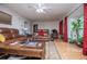 Inviting living room with a ceiling fan, plush sofas and bright natural light at 9018 Lakeview Pkwy, Villa Rica, GA 30180