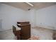 Unfurnished neutral space with concrete floors, bright overhead light, and a storage cabinet at 9018 Lakeview Pkwy, Villa Rica, GA 30180