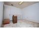 Neutral space with a storage cabinet, concrete floors, and a bright overhead light at 9018 Lakeview Pkwy, Villa Rica, GA 30180