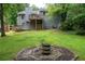 Large backyard featuring a fire pit and deck, ideal for relaxing and enjoying the outdoors at 1140 Reading Nw Dr, Acworth, GA 30102