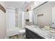 Bathroom featuring a granite vanity, tiled shower, and ample storage space at 1140 Reading Nw Dr, Acworth, GA 30102