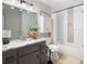 Well-lit bathroom with a granite-topped vanity and a tiled shower/tub combo at 1140 Reading Nw Dr, Acworth, GA 30102