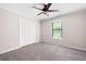 Bedroom featuring a ceiling fan, window, neutral color palette and closet at 1140 Reading Nw Dr, Acworth, GA 30102