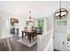 Bright dining room features hardwood floors, modern lighting and access to kitchen at 1140 Reading Nw Dr, Acworth, GA 30102