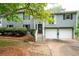 Attractive two-story home with attached two car garage and manicured front lawn at 1140 Reading Nw Dr, Acworth, GA 30102
