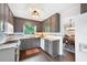 Kitchen with stainless steel appliances, gray cabinets, and tile backsplash at 1140 Reading Nw Dr, Acworth, GA 30102