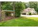 Inviting backyard with a swing and expansive lawn offers relaxation and outdoor enjoyment at 1908 Musket Ct, Stone Mountain, GA 30087