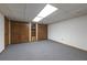 Spacious basement with carpet flooring, ample closet space, and bright overhead lighting at 1908 Musket Ct, Stone Mountain, GA 30087