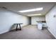 Finished basement with carpet, a table and bar area, with additional doors at 1908 Musket Ct, Stone Mountain, GA 30087