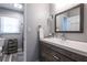 Neutral bathroom with gray vanity, white sink, and a separate shower and toilet area at 1908 Musket Ct, Stone Mountain, GA 30087