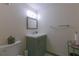 Cozy half bathroom with wood paneling, single sink, and mirror, creating an inviting space at 1908 Musket Ct, Stone Mountain, GA 30087