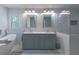 Bathroom with a soaking tub and a double sink vanity with two mirrors and accent lighting at 1908 Musket Ct, Stone Mountain, GA 30087