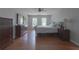 Bedroom featuring hardwood floors, windows, and a ceiling fan at 1908 Musket Ct, Stone Mountain, GA 30087