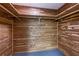 Walk-in cedar closet with wood paneling, shelving, and rod, providing natural storage space at 1908 Musket Ct, Stone Mountain, GA 30087