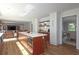Open-concept kitchen with a large island, stainless steel appliances, and a seamless transition to the living area at 1908 Musket Ct, Stone Mountain, GA 30087
