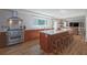 Modern kitchen with stainless steel appliances, a large island, and stylish wood cabinetry at 1908 Musket Ct, Stone Mountain, GA 30087