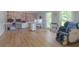 Spacious office with hardwood flooring, dual workstations, and ample natural light from large windows at 1908 Musket Ct, Stone Mountain, GA 30087