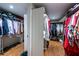 Spacious walk-in closet with plenty of storage for clothing at 1908 Musket Ct, Stone Mountain, GA 30087