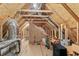 Unfinished attic space featuring exposed beams, insulation, and plywood flooring awaiting conversion or storage at 2241 N 16 Hwy, Whitesburg, GA 30185