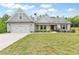 Charming single-Gathering home with a manicured lawn, two-car garage, and inviting curb appeal at 2241 N 16 Hwy, Whitesburg, GA 30185