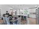 Eat-in kitchen featuring a central island, stainless appliances, and modern white cabinetry at 2241 N 16 Hwy, Whitesburg, GA 30185