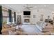 Bright living room featuring a fireplace, vaulted ceiling, and plush seating arrangement at 2241 N 16 Hwy, Whitesburg, GA 30185
