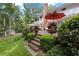 Expansive back deck with outdoor seating, surrounded by lush landscaping and mature trees for a private retreat at 260 Waverly Hall Dr, Roswell, GA 30075