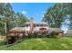 Large, manicured backyard with a spacious deck, perfect for entertaining and enjoying the outdoor space at 260 Waverly Hall Dr, Roswell, GA 30075
