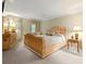 This bedroom features a chandelier, light green walls, and neutral carpeting at 260 Waverly Hall Dr, Roswell, GA 30075