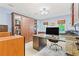 This home office features custom built-in shelving, a desk with a computer and a marble countertop at 260 Waverly Hall Dr, Roswell, GA 30075