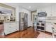 Modern kitchen featuring a stainless steel refrigerator, oven, and ample cabinet space at 260 Waverly Hall Dr, Roswell, GA 30075
