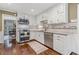 Well-appointed kitchen with white cabinetry, granite countertops, and stainless steel appliances at 260 Waverly Hall Dr, Roswell, GA 30075