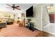 Spacious living room with a ceiling fan and hardwood floors, ideal for relaxing or entertaining guests at 260 Waverly Hall Dr, Roswell, GA 30075