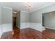 Elegant dining room with hardwood floors, wainscoting, and a chandelier, perfect for hosting gatherings at 5018 Upper Elm St, Atlanta, GA 30349