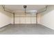 Spacious garage with concrete floor and automatic door system at 5018 Upper Elm St, Atlanta, GA 30349