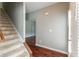 Hallway with hardwood floors and carpeted stairs, providing a smooth transition between levels at 5018 Upper Elm St, Atlanta, GA 30349