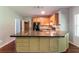 Spacious kitchen island with storage, granite countertops, and wood cabinets, offering ample workspace at 5018 Upper Elm St, Atlanta, GA 30349