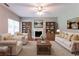 Comfortable living room with fireplace, built-in bookshelves, and plush seating at 5018 Upper Elm St, Atlanta, GA 30349