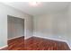 Cozy living room features hardwood floors, neutral paint, and an open doorway for a great flow at 5018 Upper Elm St, Atlanta, GA 30349