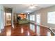 Open floor plan showing the kitchen island and hardwood floors leading to a bright, open space at 5018 Upper Elm St, Atlanta, GA 30349
