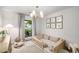 Bright bedroom featuring a cozy bed, soft natural lighting, and a view of the outdoors at 5315 Bentley Hall Dr, Alpharetta, GA 30005