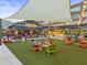 Inviting outdoor area with lounge chairs and a vibrant scene at Cherry Street Brewpub at 5315 Bentley Hall Dr, Alpharetta, GA 30005