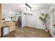 Open dining area with modern chandelier and views into the kitchen at 5315 Bentley Hall Dr, Alpharetta, GA 30005