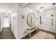 Inviting entryway featuring a stylish mirror, bench, and ample natural light at 5315 Bentley Hall Dr, Alpharetta, GA 30005